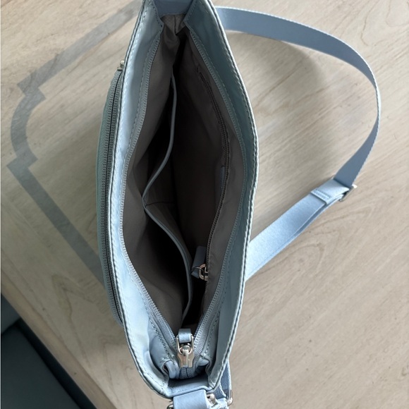 Tumi Blue Crossbody Bag with Adjustable Strap and Minimalist Design - Picture 5 of 8